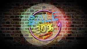 SALE 30% neon sign on a dark brick wall