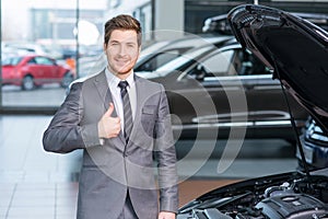 Sale assistant working in auto salon