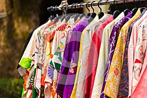 Sale of colorful kimonos on the city street in Kyoto, Japan. Close-up.
