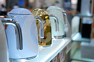 Sale of electric kettles on the shelf in the store