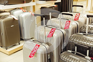 Sale of gray and black suitcases in the store photo