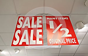 Sale half price shop signs