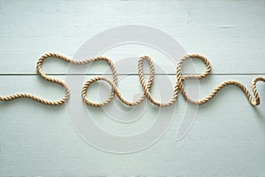 Sale inscription is written using a rope made of jute