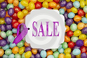 Sale message gift tag over colorful jellybean candy
