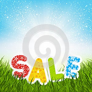 Sale message on green grass