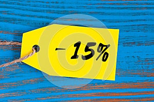 Sale minus 15 percent. Big sales fifteen percents on blue wooden background for flyer, poster, shopping, sign, discount