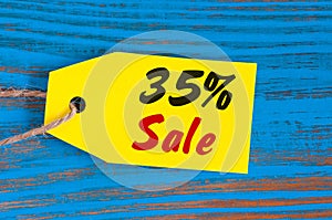 Sale minus 35 percent. Big sales thirty five percents on blue wooden background for flyer, poster, shopping, sign