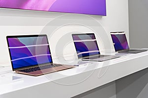 sale of modern laptops in electronics stores. exhibition hall of equipment. latest models photo