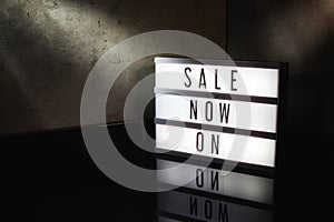 Sale now on message on a light box