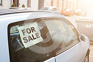 For sale. old dirty car on the street with inscription in the window