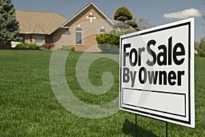 For Sale By Owner Sign In Front of House photo