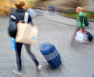 Sale. People with suitcases in a hurry