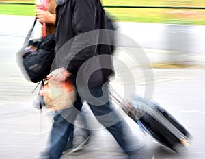 Sale. People with suitcases in a hurry