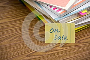 On Sale; The Pile of Business Documents on the Desk