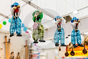 sale of puppets at the fair. A puppet is a kind of controlled Theater doll with the help of a rope