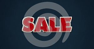 Sale. Red word with white contour on dark blue background with textile texture.