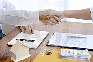 Sale representative or insurance broker handshake with customer