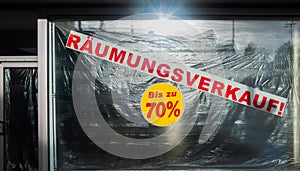 Sale RÃÂ¤umungsverkauf Sign in red Shopping Window photo