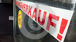 Sale RÃ¤umungsverkauf Sign in red Shopping Window