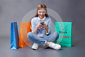 Sale, shopping, discount and Black Friday concept. Black friday. Woman with shopping bags.