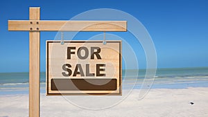 Sale sign at the beach