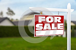 Sale sign near beautiful house outdoors. Red signboard with words