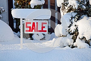 Sale sign in winter with snow