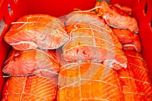 Sale of smoked Kamchatka fish. Far Eastern seafood, natural smoked fish - sockeye salmon at the city Christmas market