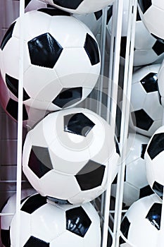 Sale of soccer balls in a sports store. Vertical photo. Close-up