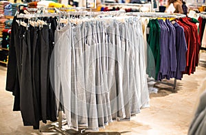 Sale in a store of fashionable and stylish winter clothes. Warm pants hang on a hanger, sale.