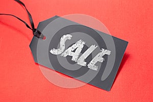 Sale tag for Black Friday or promo action in shop on the red background. Discount sticker template