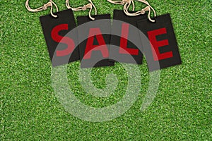 Sale Tags on Green Grass