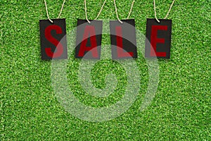 Sale Tags on Green Grass