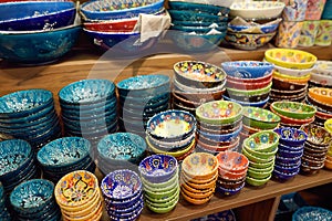 Sale of traditional colorful Turkish ceramics dishes in the Istanbul Grand Bazaar, Istanbul. Authentic gifts and souvenirs from