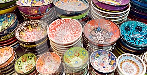 Sale of traditional colorful Turkish ceramics dishes in the Istanbul Grand Bazaar, Istanbul. Authentic gifts and souvenirs from