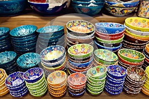 Sale of traditional colorful Turkish ceramics dishes in the Istanbul Grand Bazaar, Istanbul. Authentic gifts and souvenirs from