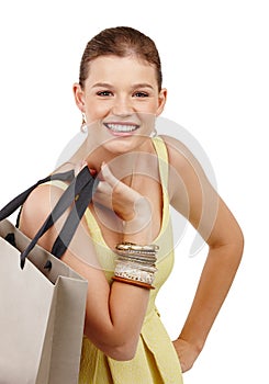 That sale was awesome. Closeup shot of a pretty teenage girl carrying a shopping bag over her shoulder.