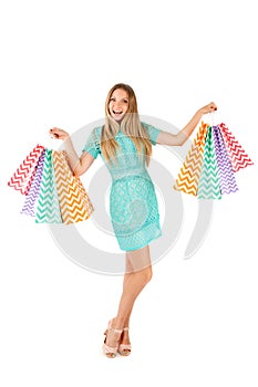 Sale. Young woman with many shopping bags. Portrait of a girl on shopping