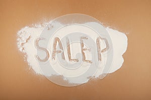 Salep flour on beige background. Salep flour is consumed in beverages and desserts