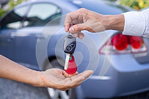 Sales agencies are selling cars and giving keys to new owners. sell car or rental car photo