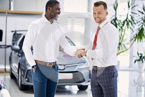 Sales agent and customer man shaking hands