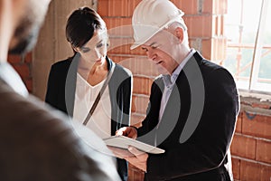 Sales Agent Showing New House To Husband And Wife