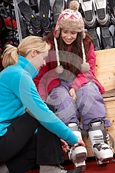 Sales Assistant Helping Teenage Girl