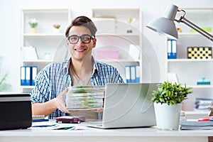 The sales assistant at publishing house showing ready printed books