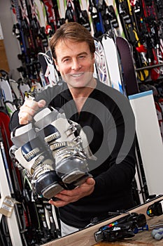 Sales Assistant With Ski Boots In Hire Shop