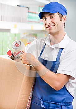 Sales clerk with cardboard box