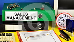 Sales management. Text label on the folder office of the Registrar.