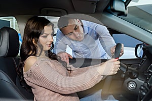 Sales manager explaining details to customer in showroom