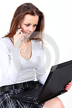 Sales manager with notebook and mobile phone