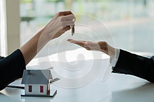 The sales manager or real estate agent gives the customer the keys after signing the lease, or Buying a Home with Home Loan and Ho